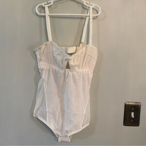 We are HAH Under the Wire Mesh Bodysuit in Walking on Eggshells white small